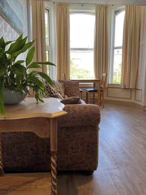 Apartment 3 - Double bed | Living area | 40-inch Smart TV with cable channels - The Hutchinson Apartments (Douglas)