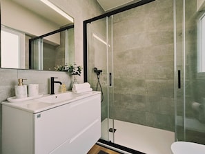 Shower, hair dryer, towels, soap