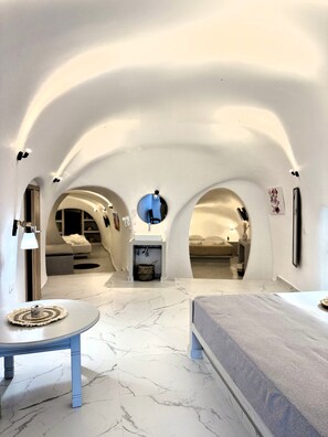 Superior Apartment | Living area | 32-inch flat-screen TV with digital channels - Cave Crafted Suites (Santorini)