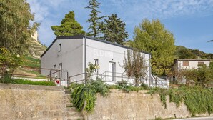 A building with the name 'ELCHIMA' on its facade, surrounded by greenery and a stone wall. - Elfranch - El.Chi.Ma. by Wonderful Italy (Polizzi Generosa)