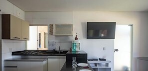 Fridge, microwave, stovetop, coffee/tea maker