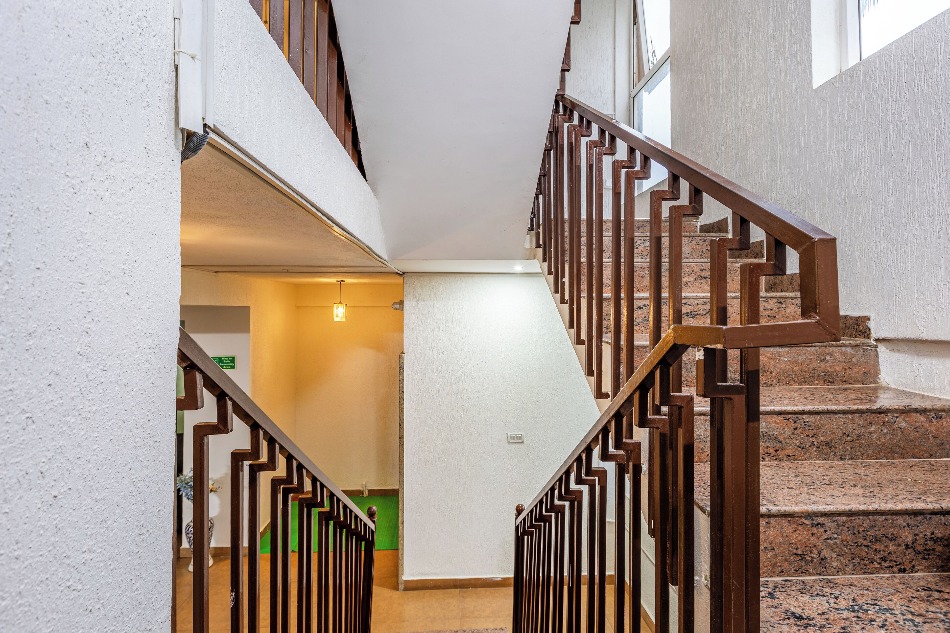 A staircase with wooden railings leading to an upper floor.