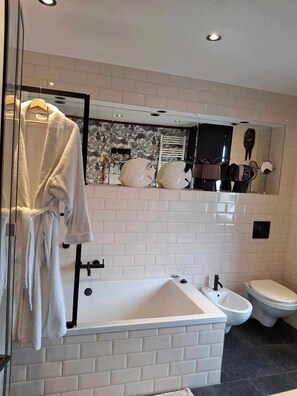 Bidet, towels, soap, toilet paper