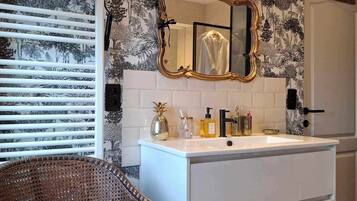 Bidet, towels, soap, toilet paper