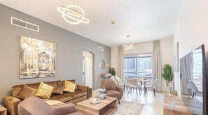 Luxury Apartment, Balcony, City View | Living area | 65-inch Smart TV with cable channels - Vogue | Marina Diamond near Marina Mall | JBR (Dubai)