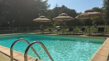 Seasonal outdoor pool, open 9:00 AM to 7:00 PM, pool umbrellas