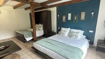 Family Quadruple Room | Blackout drapes, iron/ironing board, travel crib, free WiFi