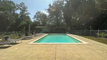 Seasonal outdoor pool, open 9:00 AM to 7:00 PM, pool umbrellas