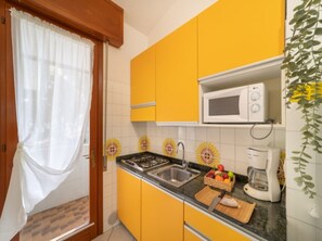 Fridge, microwave, stovetop, coffee/tea maker