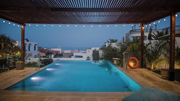 Outdoor pool, open 9:00 AM to 10:00 PM, pool umbrellas, sun loungers