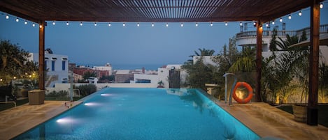 Outdoor pool, open 9:00 AM to 10:00 PM, pool umbrellas, sun loungers
