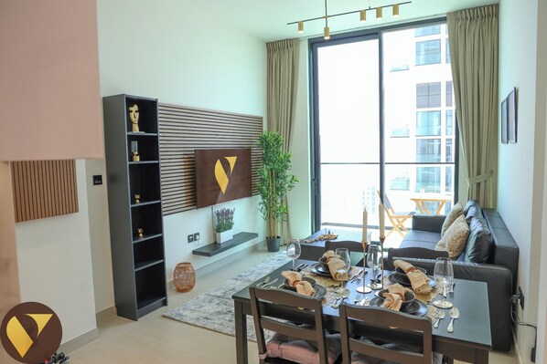 Luxury Apartment, Balcony, City View | Living area | 55-inch Smart TV with cable channels - Olympic Pool 5 Mins Drive to Circle Mal (Dubai)