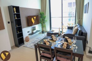 Luxury Apartment, Balcony, City View | In-room dining