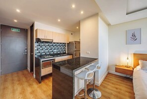 Fridge, microwave, stovetop, coffee/tea maker