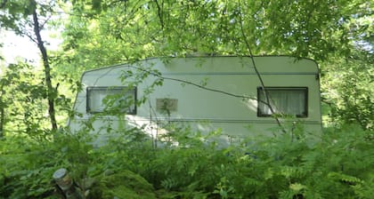 Caravan and campsite in the countryside near the lake and beach
