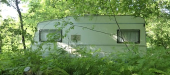 Caravan and campsite in the countryside near the lake and beach