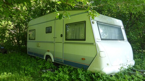 Caravan and campsite in the countryside near the lake and beach