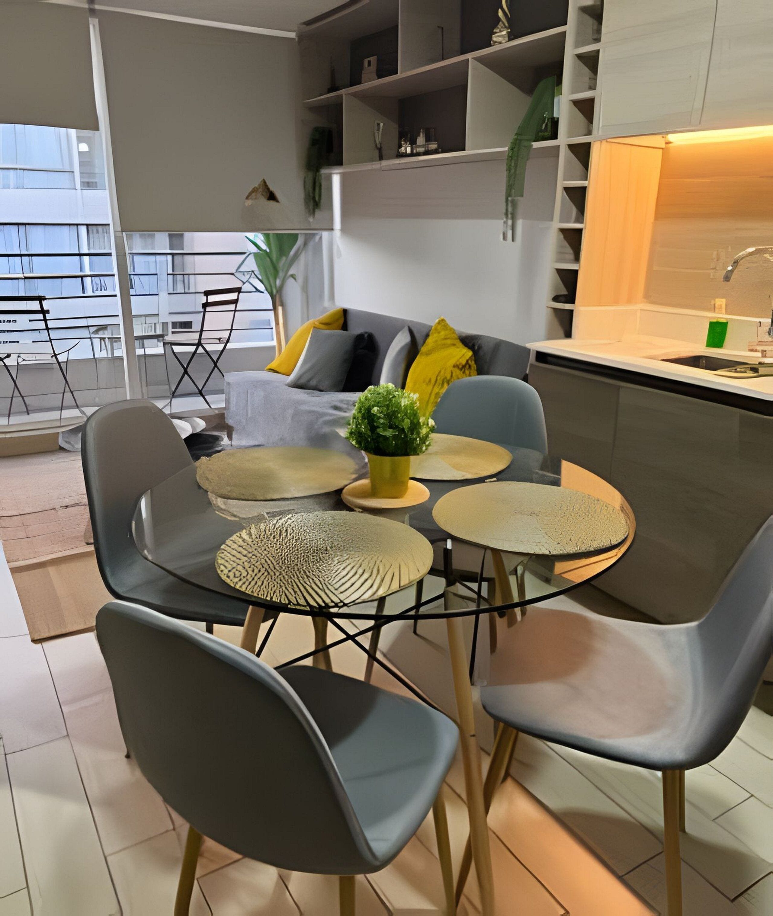 A modern kitchen with a dining area.