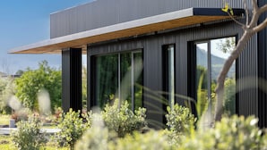A modern building with large windows and a flat roof. - Scorzamara Exclusive Country Lodges - Private Pool or Jacuzzi (Melilli)