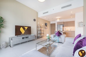 Appartement Luxe, balcon, vue ville | Coin séjour