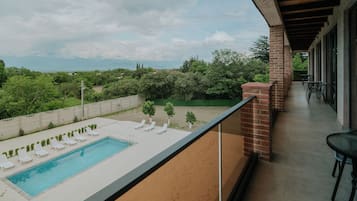 Deluxe Double Room, 1 King Bed with Sofa bed, Balcony, Pool View | Terrace/patio