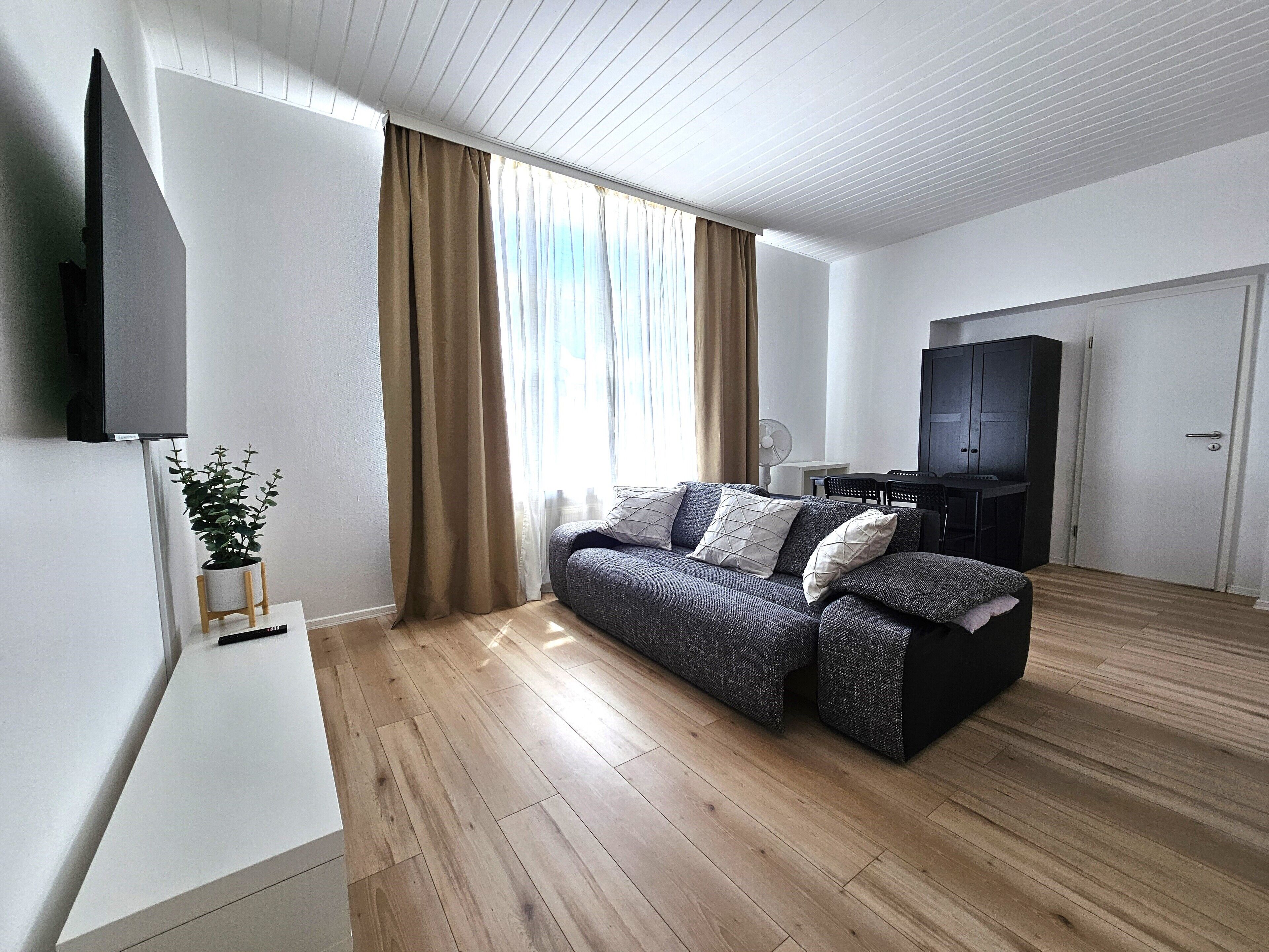 Family Apartment, Courtyard View | Living area | 100-cm Smart TV with digital channels