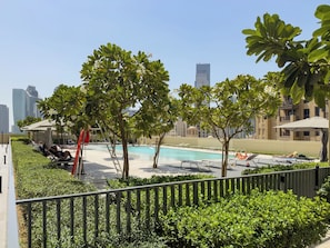 Outdoor pool, open 8:00 AM to 7:00 PM, pool umbrellas, pool loungers