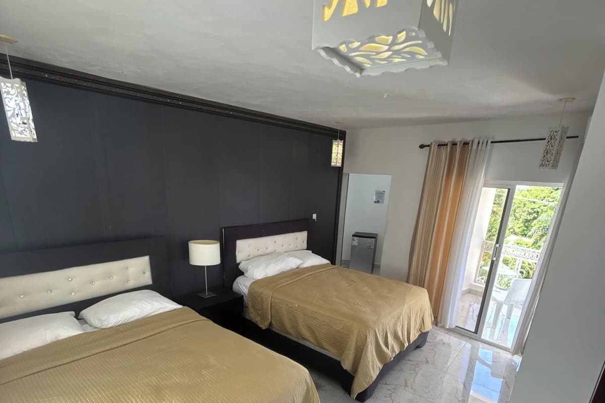 Deluxe Double Room, Balcony, Beach View | Down comforters, Select Comfort beds, individually decorated