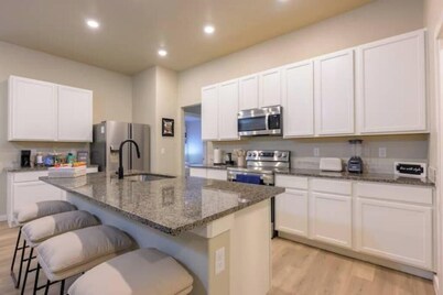 Four beds w/ 1 king, 3 queen beds each with a TV. Centrally located! No pets