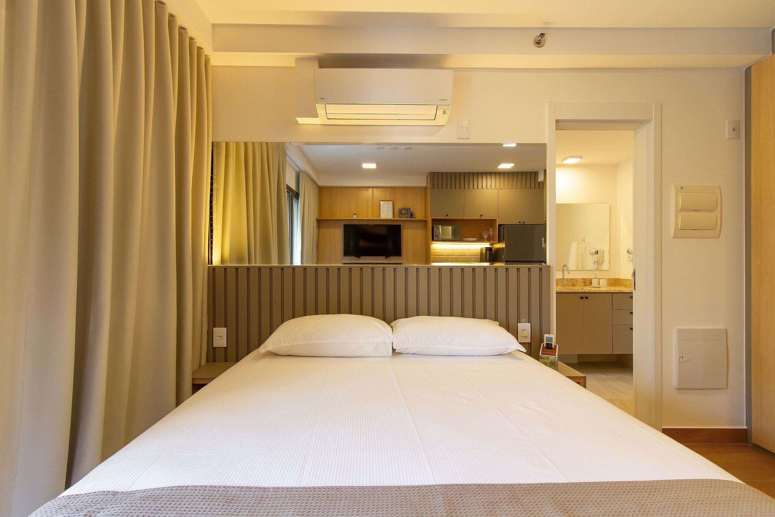 Departamento empresarial | Camas con pillow-top, tabla de planchar con plancha y wifi gratis 