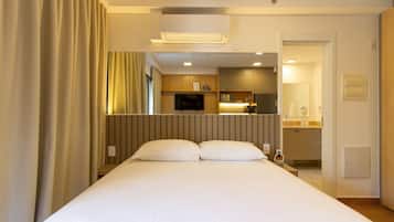 Departamento empresarial | Camas con pillow-top, tabla de planchar con plancha y wifi gratis