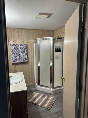 Shower, hair dryer, towels, soap