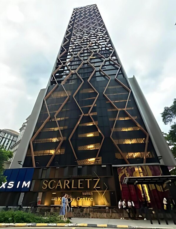 A tall building with a geometric facade and the name "Scarletz" prominently displayed.
