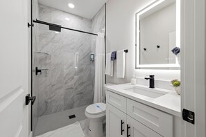 Shower, hair dryer, towels, soap