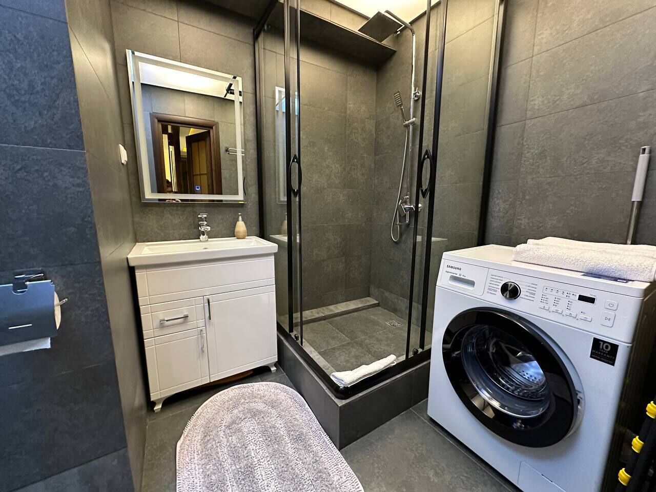 Shower, hair dryer, towels, toilet paper