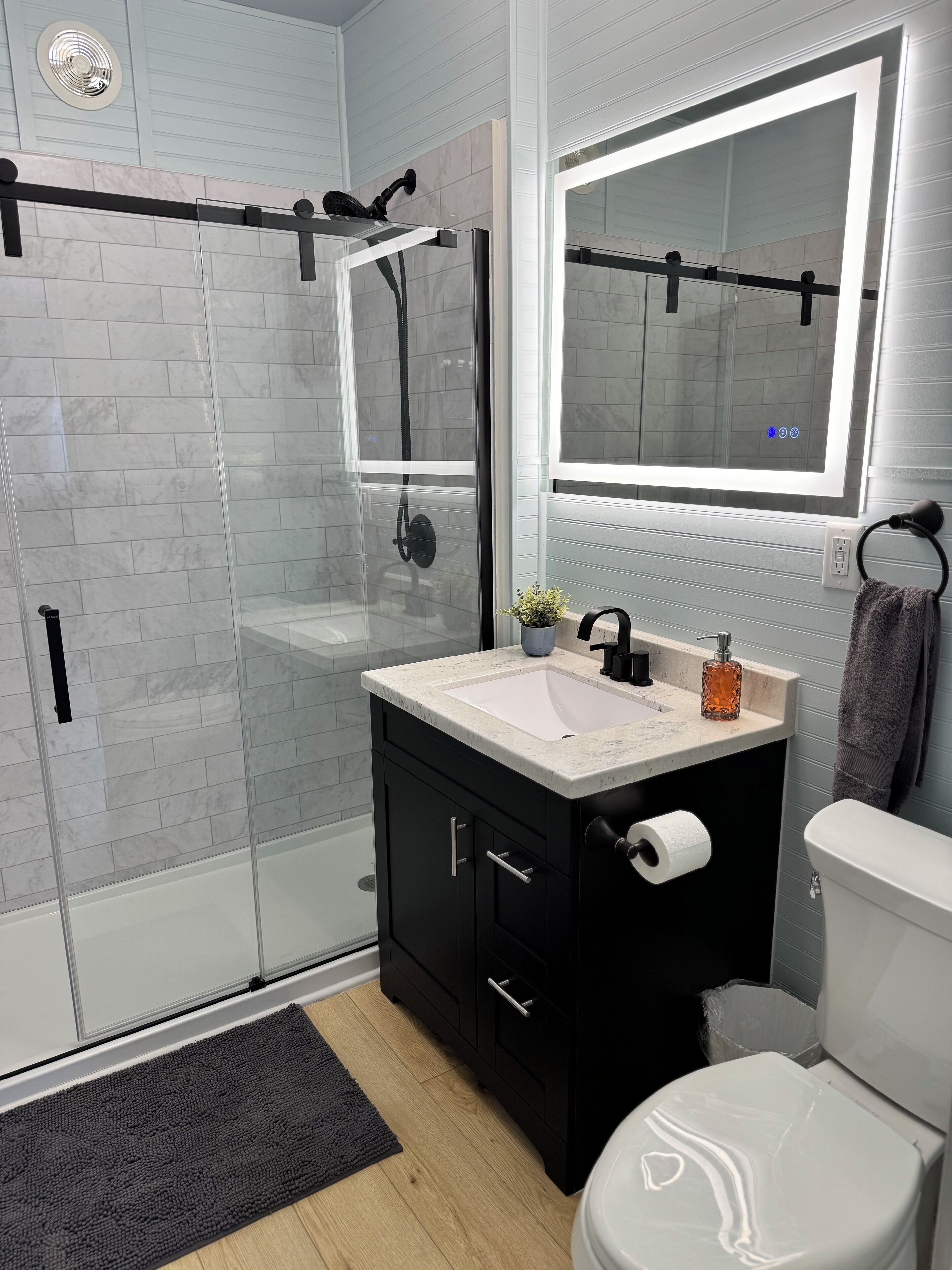Shower, hair dryer, towels, toilet paper