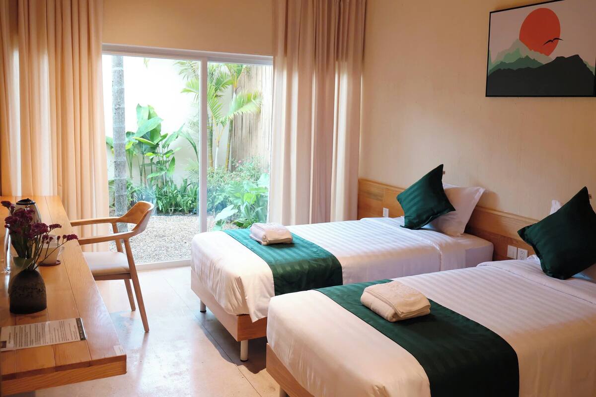 Deluxe Twin Room, Garden View | Blackout drapes, soundproofing, iron/ironing board, free WiFi