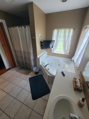 Shower, jetted bath, bidet, towels