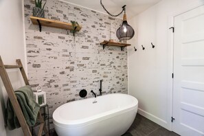 Shower, hair dryer, towels, toilet paper