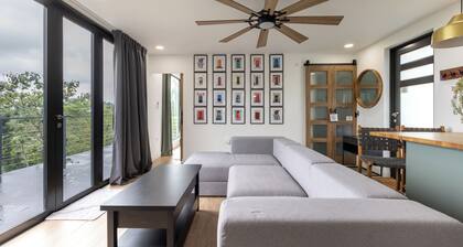 Unique modern container home perched in the lush mountains of Rio Grande.
