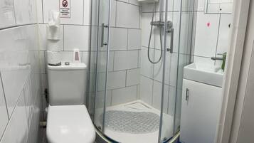Shower, towels, soap, toilet paper