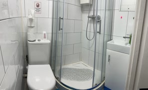 Shower, towels, soap, toilet paper