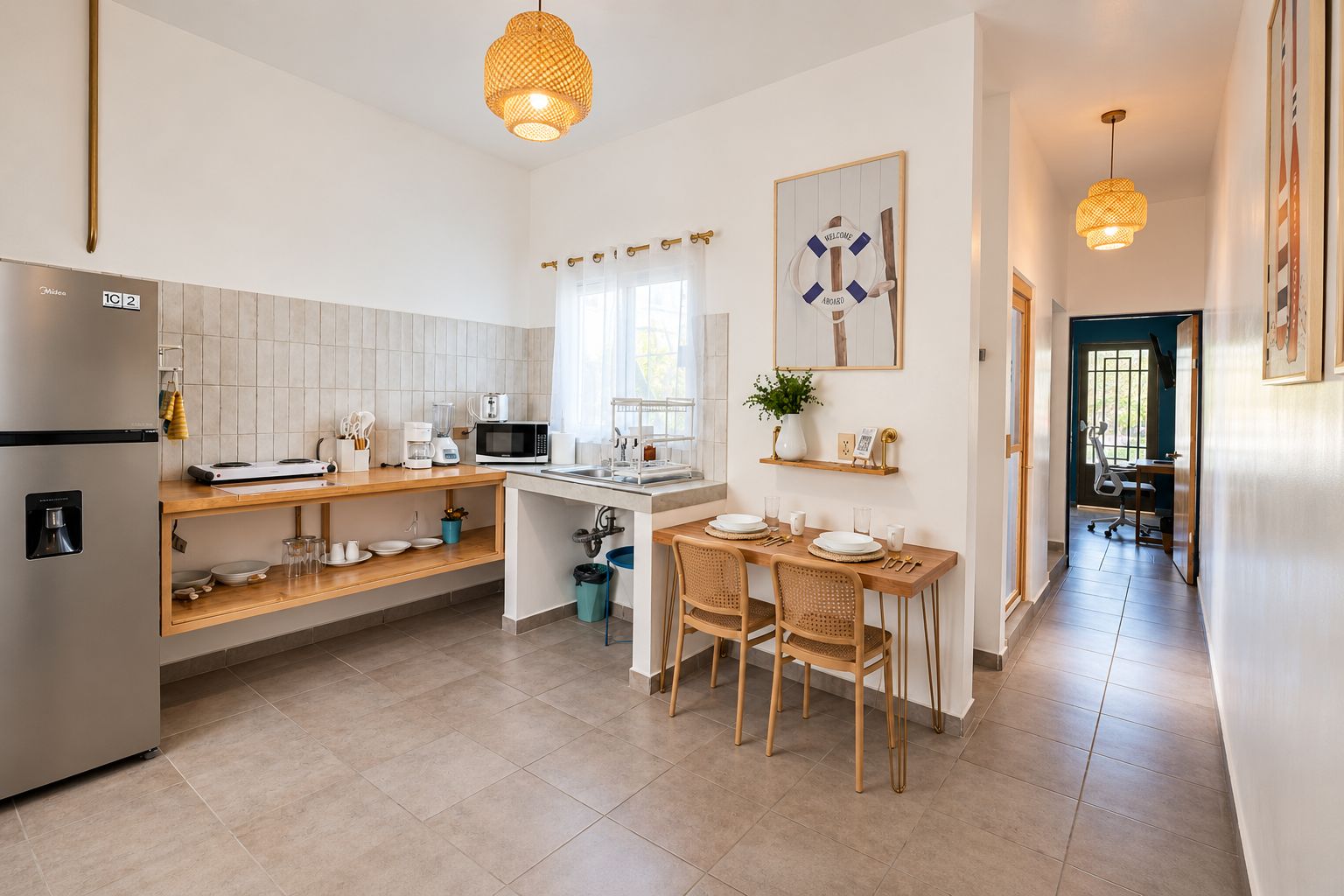 A modern kitchen with a built-in microwave, a coffee maker, and a dining area with a table and chairs.