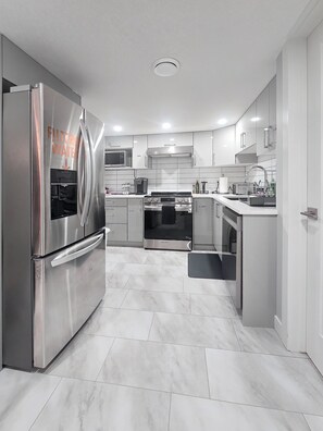 Microwave, oven, stovetop, dishwasher - The Orchards Haven – Luxury Basement 2BR Suite |Chef’s Kitchen |Office |Near YEG (Edmonton)