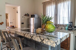 Fridge, microwave, stovetop, coffee/tea maker