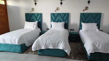 Luxury Triple Room, Pool View | Blackout curtains, free WiFi