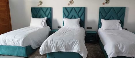 Luxury Triple Room, Pool View | Blackout drapes, free WiFi