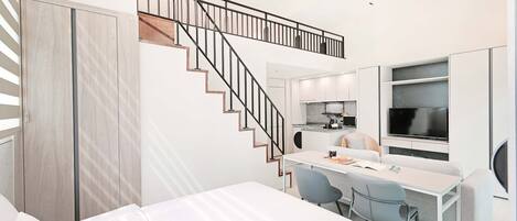 Habitación de hotel moderna con cama, escritorio, sillas, televisor y una escalera.
