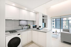 Luxury Double Room, City View | Living area | TV