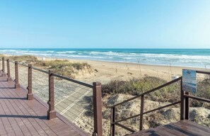 On the beach, sun-loungers, beach towels